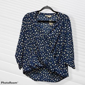 All in favor Polk a dot faux wrap top